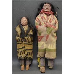 TWO SKOOKUM DOLL