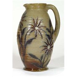 Stoneware jug incised with stylised flower…