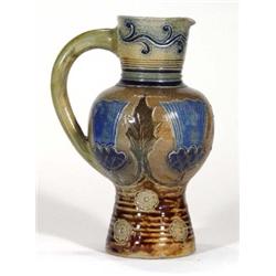 Stoneware jug incised with thistles and fl…