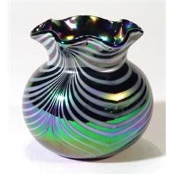 White and iridescent glass vase with frill…