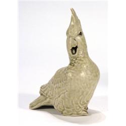 Grey glazed continental pottery parrot, ma…