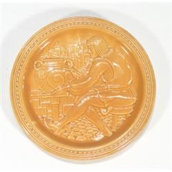 Brown glazed plate depicting an American p…