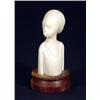 Carved ivory bust of an African woman on a…