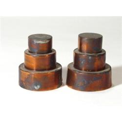 Pair of copper stepped jelly moulds, marks…