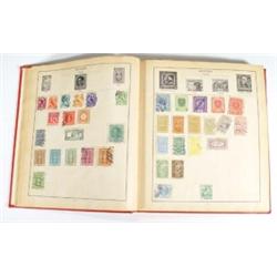 Red Strand stamp album containing a large …