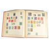 Image 1 : Red Strand stamp album containing a large …