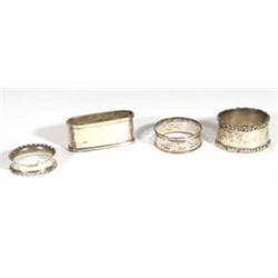 Four assorted silver napkin rings, one wit…