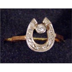 Gold diamond set horseshoe ring…