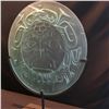 Image 3 : JOHN NUTTER, "BIRTH OF THE TSIMSHIAN NATION" ETCHED ROUND GLASS PANEL ON METAL BASE,  DESIGN BY