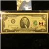 Image 1 : Series 1976 U.S. Two Dollar Federal Reserve Note, CU. Postmarked and stamped with a 13c Stamp on the
