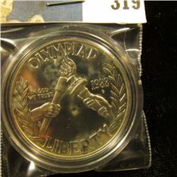 1988 S U.S. Olympics Proof Silver Dollar, encapsulated.