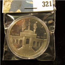 1984 S U.S. Olympics Cameo Frosted Proof Silver Dollar, stylized Eagle reverse, encapsulated.