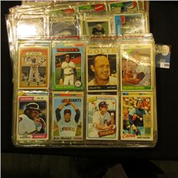 A group of more than (20) Plastic pages with Baseball Cards, some of which have been autographed. A 