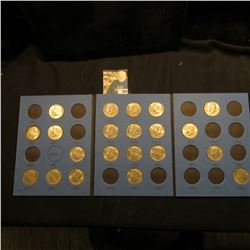 1964-85 Partial Set of Kennedy Half Dollars in a blue Whitman folder. All BU or toned BU.