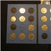 Image 2 : 1964-85 Partial Set of Kennedy Half Dollars in a blue Whitman folder. All BU or toned BU.