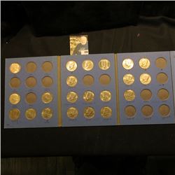1964-82 Partial Set of Kennedy Half Dollars in a blue Whitman folder. All BU or toned BU.