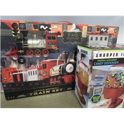 FAO SCHWARZ 34-PIECE MOTORIZED TRAIN SET/SHARPER IMAGE CANDY DISPENSER