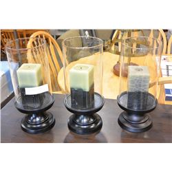 THREE DECORATOR PEDESTLE CANDLES