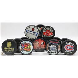 FLAT OF HOCKEY PUCKS.