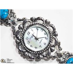7) CONTINENTAL STAINLESS STEEL TURQUOISE WATCH