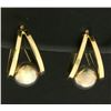Image 1 : Half Hoop Designer Earrings with Suspended Sphere in 14k Gold