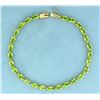 Image 1 : 18 Carat Peridot Bracelet in 14k Gold