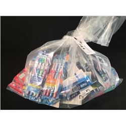 BAG OF ASSORTED TOOTHBRUSHES & TOOTHPASTE