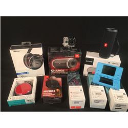 LOT OF ASSORTED BLUETOOTH SPEAKERS, HEADPHONES, FITBITS, GO PRO & MORE