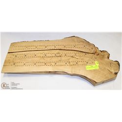 HUGE CRIB BOARD ON TREE STUMP.