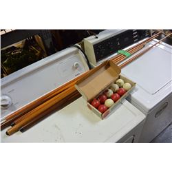 BUNDLE OF POOL CUES AND BUMPER BALLS
