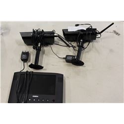 TWO UNIDEN SECURITY CAMERAS AND TRANSMITTER MODULE