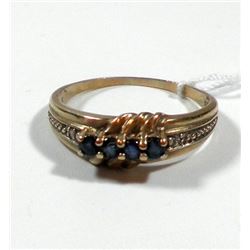 K8 gold ring set with 4 blue facetes stones