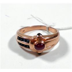 K14 gold ring set with sapphires and a ruby