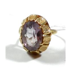 K14 gold ring with a faceted purple gemstone setting