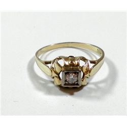 K14 gold ring set with an old faceted central diamond