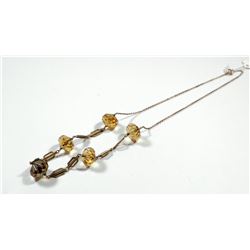 K9 gold necklace combining faceted citrine gemstones