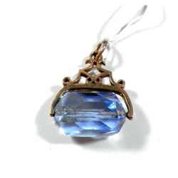 K9 gold pendant with revolving blue stone setting