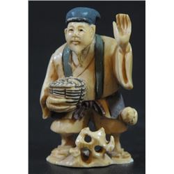 Man with basket, old ivory netsuke