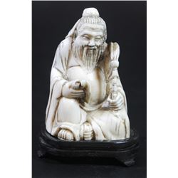 Chinese man reading a scroll - antique ivory figurine