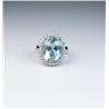 Image 1 : 18CAI-5 AQUAMARINE & DIAMOND RINGCaptivating Princess Diana style ring  featuring an oval blue Aquam