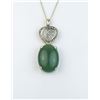 Image 1 : 18CAI-52 JADEITE/JADE PENDANTElegant pendant featured a green Jadeite/  Jade weighing 14.30 carats a
