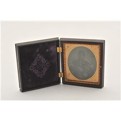 18ASS-17 TINTYPETintype of Civil War era soldier, in uniform,  holding the grip of his belt sheathed