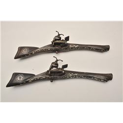18AR-28 PAIR MIQUELETPair of North African miquelete flintlock  “Dag” style blunderbuss with ornate 