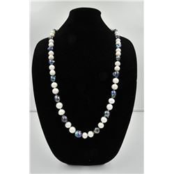 18PRS-7 PEARLSOne very fine opera length(36 inches) strand  of black and   white baroque pearls  app