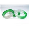 Image 1 : 18CAI-56 3 BANGLE BRACELETSLot of three Green and Lavender Jade bangle  bracelets. Estimates $300-$7