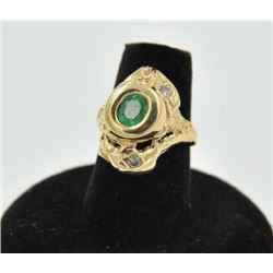 18RPS-25 EMERALD & DIAMOND RINGOne free form floral designed ring set with  an oval emerald and diam