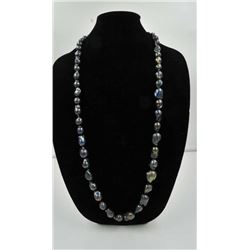 18RPS-38 BLACK BAROQUE PEARLSOne 14k yellow gold bypass  ring set with a  center  diamond weighing 0