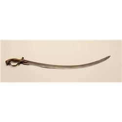 18AT-6 INDIAN SWORDIndian sword with cast brass lion’s head  grip.  The sword is approximately 32” i