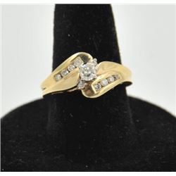 18RPS-37 DIAMOND RINGOne 14k yellow gold bypass  ring set with a  center  diamond weighing 0.20ct pl