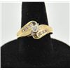 Image 1 : 18RPS-37 DIAMOND RINGOne 14k yellow gold bypass  ring set with a  center  diamond weighing 0.20ct pl